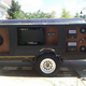 Illustration for article titled Giant BBQ Grill Trailer: Electronics and Pork Make a Great Combination